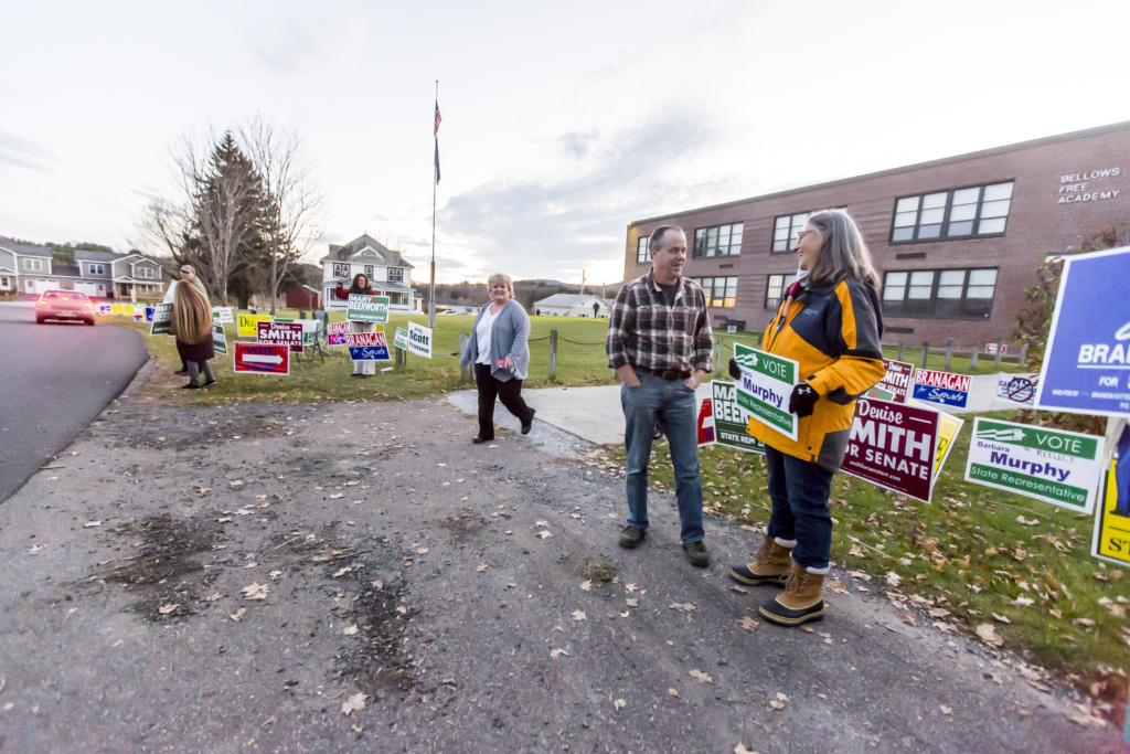 Barbra Murphy, right, talks with a voter outside the polls on Tuesday.
