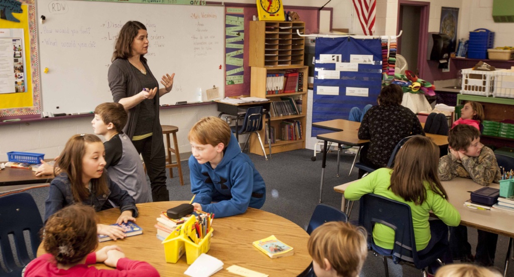 Mary Ellis works with her fourth grade students in this file photo from 2014.