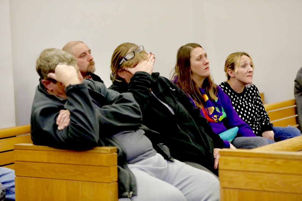 Friends and family of Chad Ely sit behind Ely in Criminal Court on Monday.